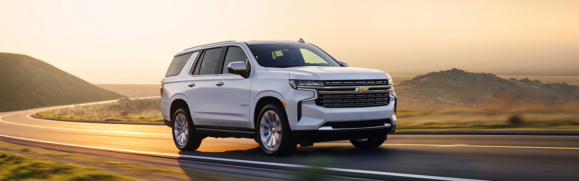 A white 2021 Chevy Tahoe from the side