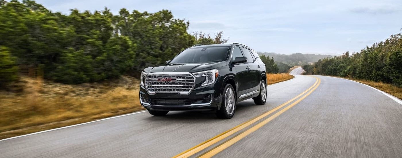Black 2022 GMC Terrain Denali on an open road