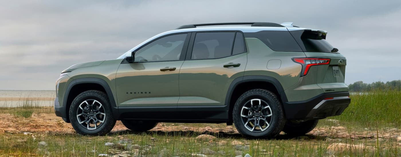 Rear of a green 2026 Chevy Equinox parked off-road.