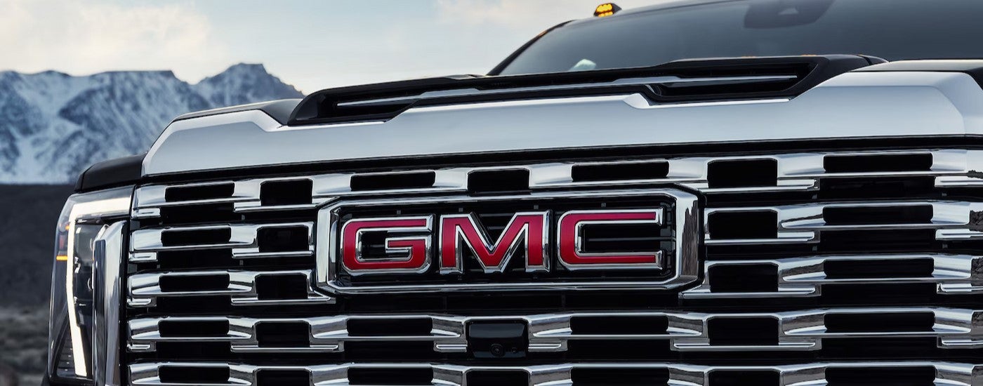 Close-up of the grille on a black 2025 CMC Sierra HD for sale near Lawrence.