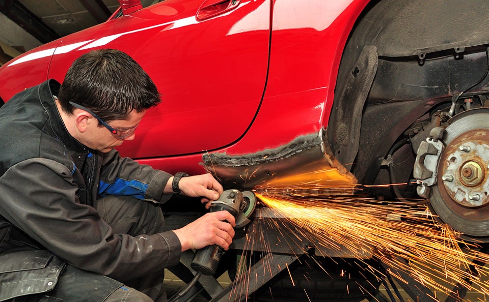 Body work on a red car